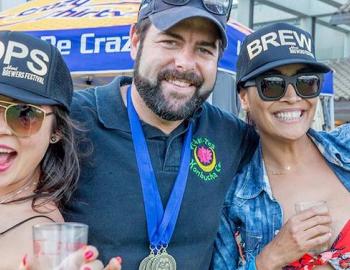 4 people outside at a beer festival