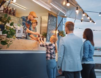 people buying food from a food truck