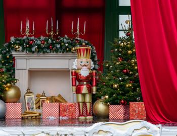 a nutcracker doll in front of a christmas themed setting 