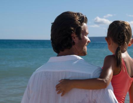 Father and Daughter looking at Maui Ocean