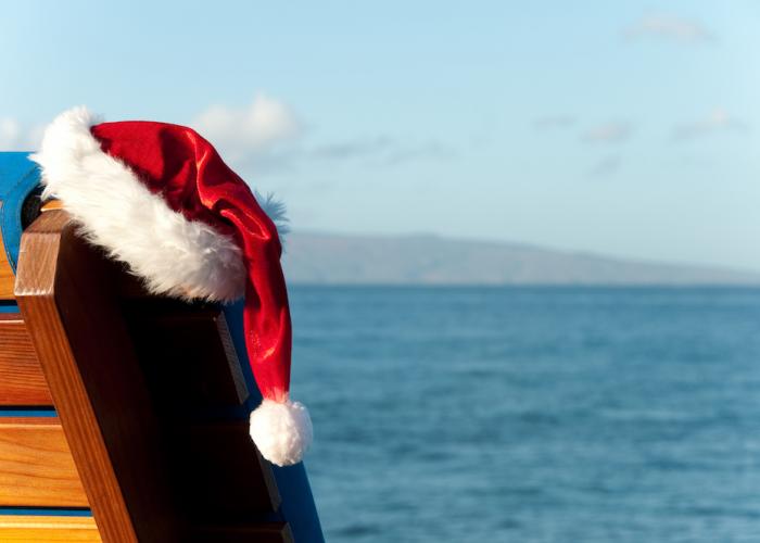 santa hat hanging on a beach chair in maui