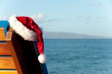 santa hat hanging on a beach chair in maui