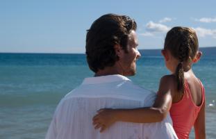 Father and Daughter looking at Maui Ocean