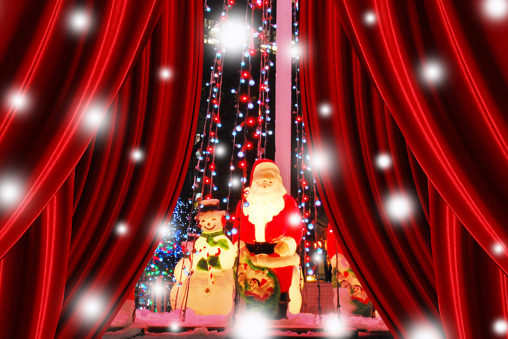 Santa and snowman statues on a stage
